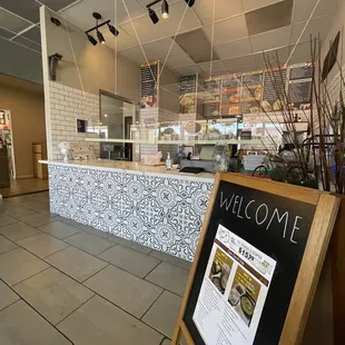 a welcome sign in a restaurant