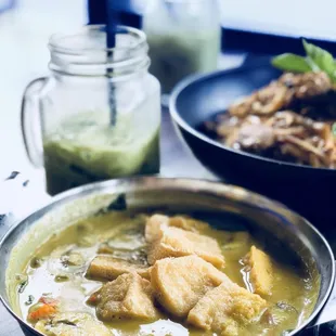 a bowl of soup and a plate of food