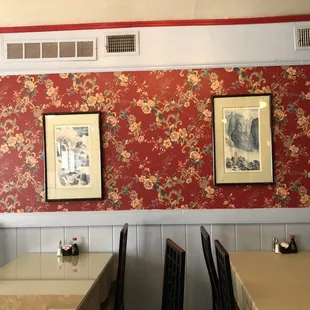 two framed pictures on the wall