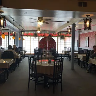 a dining room with tables and chairs