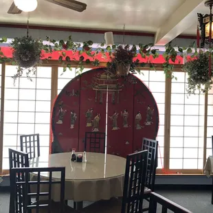 a dining room with a table and chairs