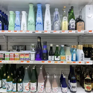 a variety of sake drinks on shelves