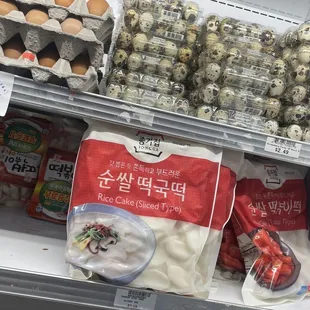 a variety of eggs in a display case