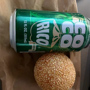 a can of soda and a burger