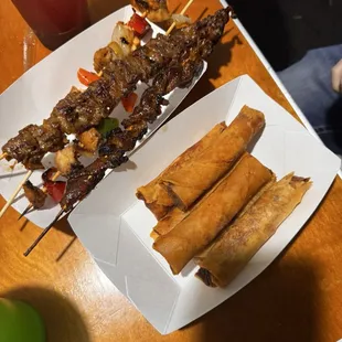 Chicken and Steak skewers. Spring rolls.