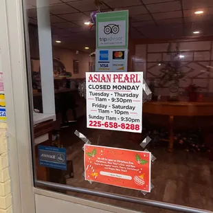 Outside with hours on door