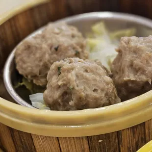 three meatballs in a bowl