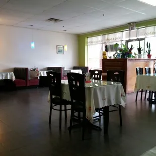 a dining room with tables and chairs