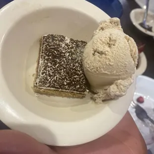 Tiramisu bite with coffee flavored ice cream scoop