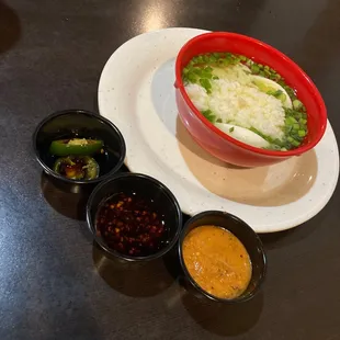 Hot sauces with some chicken noodle and rice