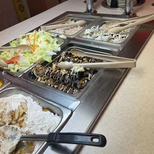 a buffet with many different types of food