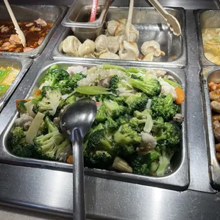 a variety of food in a buffet