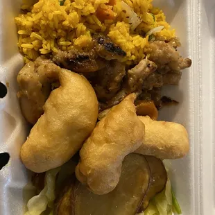 chicken, rice, and vegetables in a styrofoam container