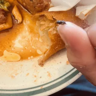 a person holding a plate of food