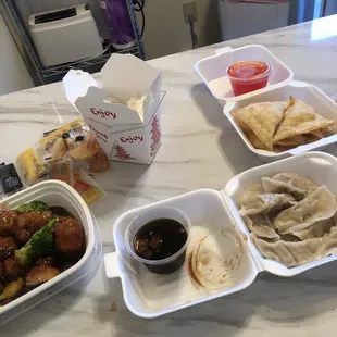 Steamed dumplings, sesame chicken w/ white rice &amp; crab Rangoon.
