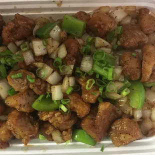 chicken and onions in a styrofoam container