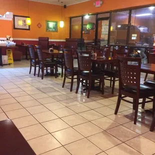 a restaurant with tables and chairs