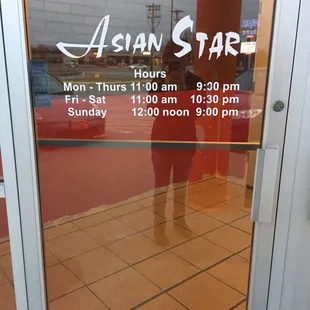 the reflection of a person in the window