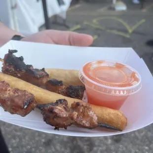 Lumpia and meat skewers