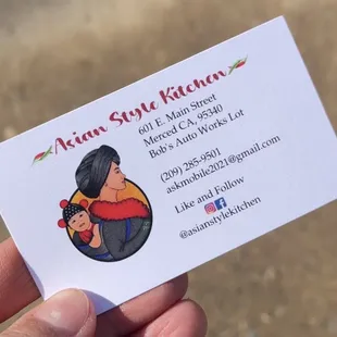 hand holding business card