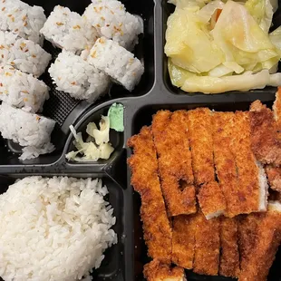 chicken, rice, and vegetables in a plastic container