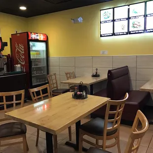 a restaurant with tables and chairs