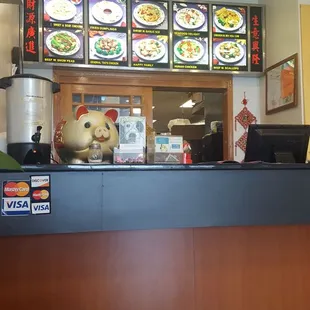a restaurant counter with a stuffed animal
