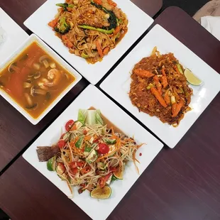 Tom yum soup, som-tam with fried fish, pad thai with seafood, and pad woon sen with moo-grob