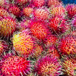 a pile of red and yellow fruit