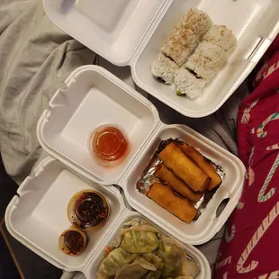 a variety of food in styrofoam containers