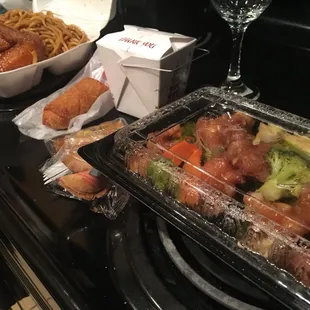 Orange chicken with vegetables. Fried rice. Veggie roll, wings and lo mien.