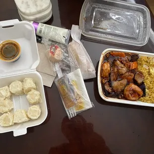 Shrimp Dumplings (Left), Utensils/Napkins/Sauces/Egg roll (Middle), Eggplant &amp; Shrimp w/ fried rice