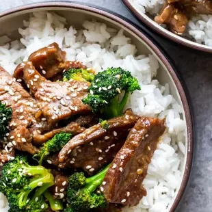 two bowls of beef and broccoli