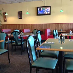 Booths and tables with two wall TVs.