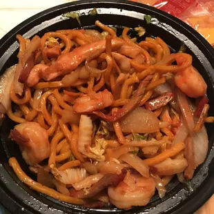a bowl of noodles and shrimp