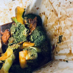 broccoli and other vegetables in a paper bag