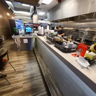 a restaurant kitchen with a long counter