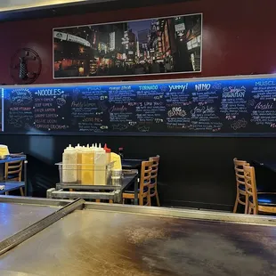 Sushi menu board behind the Hibachi grill