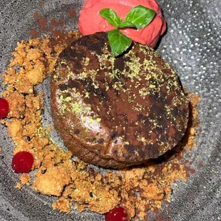 a chocolate dessert with a strawberry on top