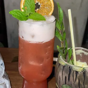 two cocktails on a wooden table