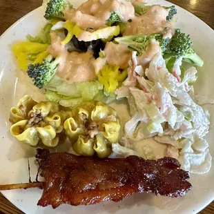 Salad, seafood salad, chicken on a stick, and Dim Sum. All good!