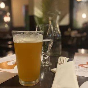 a glass of beer on a table