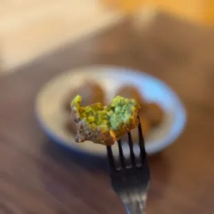 a piece of broccoli on a fork