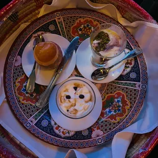 a plate of food and a cup of coffee