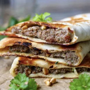 a stack of meat and cheese quesadillas