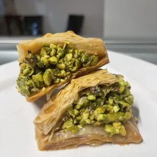 a close up of two pastries on a plate