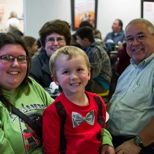 a group of people in a cafeteria