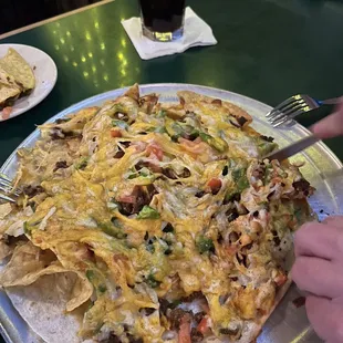 Beef Nachos... decent in flavor but hard to actually pull apart and eat without destroying the table. It&apos;s large, comes on a pizza tin