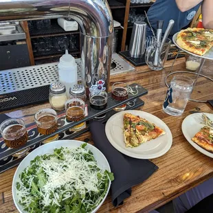 Arugula salad and caprese pizza