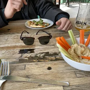Hummus plate and arugula pizza